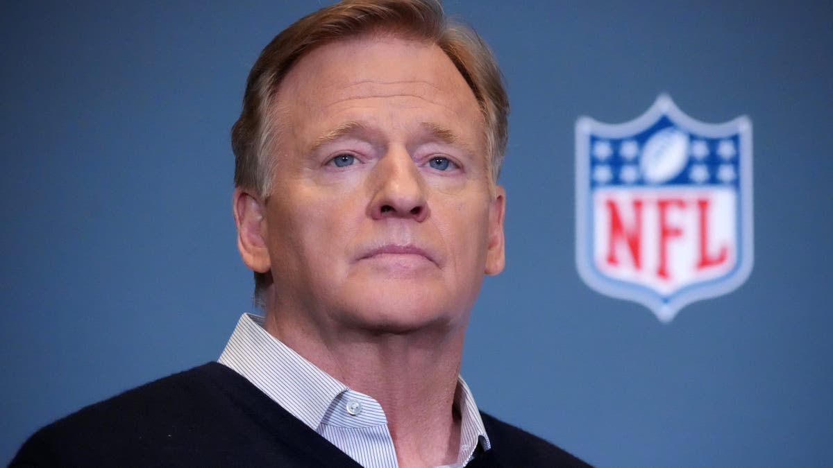 NFL Commissioner Roger Goodell standing and speaking
