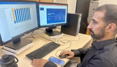 Mohammed Almasabi, a transportation engineering PhD candidate at the University of South Florida, goes over data connected to an advanced air mobility system being developed by a team at the school. (Spectrum News/Sarah Blazonis)