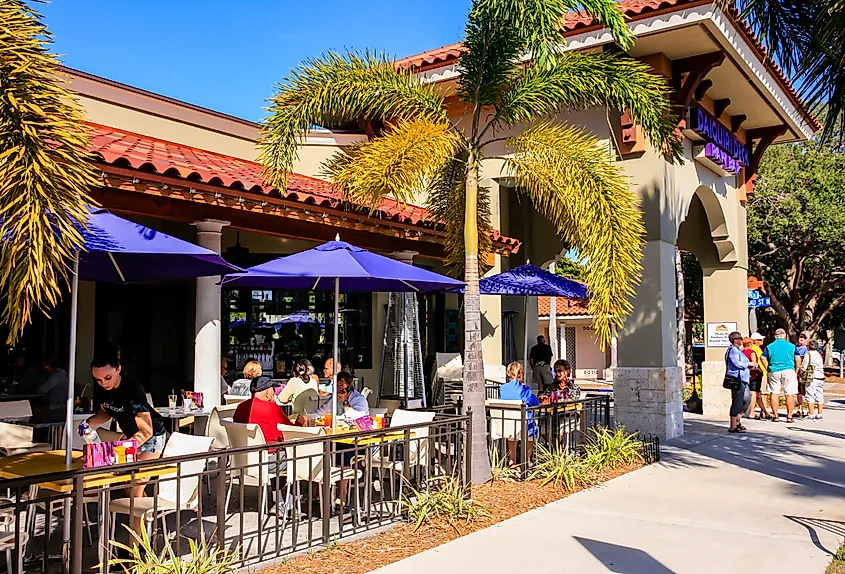 People enjoying an alfresco meal outside a restaurant in downtown Venice, Florida.