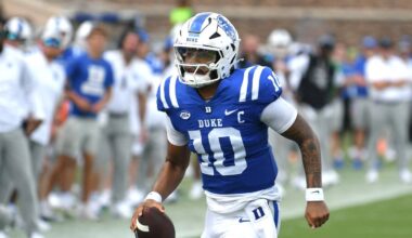 Sep 6, 2025; Durham, North Carolina, USA;  Duke Blue Devils quarterback Darian Mensah (10) runs against the Illinois Fighting Illini during the third quarter at Wallace Wade Stadium. Mandatory Credit: Zachary Taft-Imagn Images