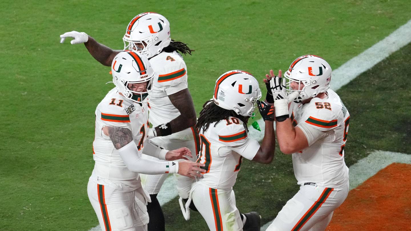 Jan 19, 2026; Miami Gardens, FL, USA; Miami Hurricanes wide receiver Malachi Toney (10) celebrates with offensive lineman James Brockermeyer (52) after scoring a touchdown against the Indiana Hoosiers during the second half of the College Football Playoff National Championship game at Hard Rock Stadium. Mandatory Credit: James Lang-Imagn Images