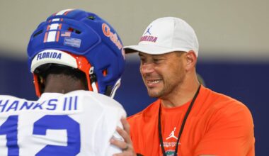 Florida head coach Jon Sumrall talks with Florida cornerback Ben Hanks II (12) during practice during spring practice at Sanders Practice Fields in Gainesville, FL on Thursday, April 2, 2026. [Alan Youngblood/Gainesville Sun]