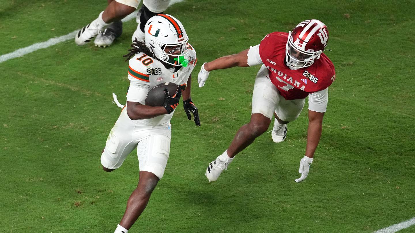 Jan 19, 2026; Miami Gardens, FL, USA; Miami Hurricanes wide receiver Malachi Toney (10) runs with the ball for a touchdown against the Indiana Hoosiers during the second half of the College Football Playoff National Championship game at Hard Rock Stadium. Mandatory Credit: James Lang-Imagn Images