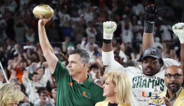 Miami Hurricanes head coach Mario Cristobal lifts the trophy after defeating Ole Miss 31-27 in the Vrbo Fiesta Bowl and CFP semifinal game at State Farm Stadium on Jan. 8, 2026, in Glendale.