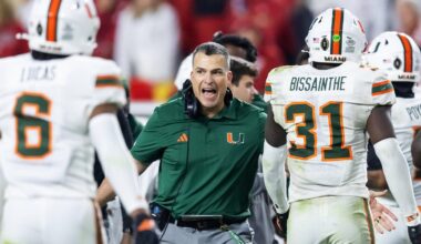 Jan 19, 2026; Miami Gardens, FL, USA; Miami Hurricanes head coach Mario Cristobal with linebacker Wesley Bissainthe (31) against the Indiana Hoosiers during the College Football Playoff National Championship game at Hard Rock Stadium. Mandatory Credit: Mark J. Rebilas-Imagn Images
