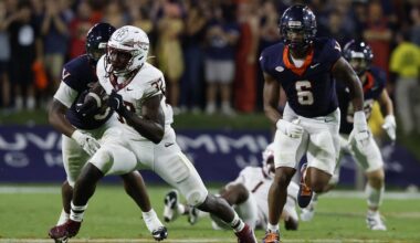 Sep 26, 2025; Charlottesville, Virginia, USA; Florida State Seminoles running back Ousmane Kromah (32) carries the ball past Virginia Cavaliers defensive end Cazeem Moore (6) at Scott Stadium. Mandatory Credit: Geoff Burke-Imagn Images