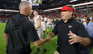 Georgia Bulldogs head coach Kirby Smart (right) shakes hands with Florida State Seminoles head coach Mike Norvell (left)