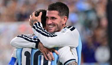 Rodrigo De Paul and Lionel Messi hug after combining to give Argentina the lead Tuesday against Algeria in a World Cup group stage match.