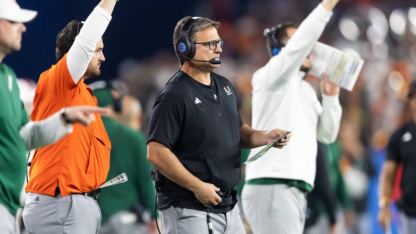 Jan 8, 2026; Glendale, AZ, USA; Miami Hurricanes offensive coordinator Shannon Dawson against the Mississippi Rebels during the 2026 Fiesta Bowl and semifinal game of the College Football Playoff at State Farm Stadium. Mandatory Credit: Mark J. Rebilas-Imagn Images