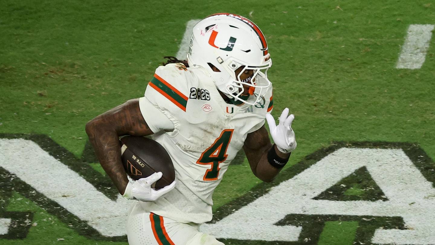 Jan 19, 2026; Miami Gardens, FL, USA; Miami Hurricanes running back Mark Fletcher Jr. (4) carries the ball against the Indiana Hoosiers in the third quarter during the College Football Playoff National Championship game at Hard Rock Stadium. Mandatory Credit: Kim Klement Neitzel-Imagn Images