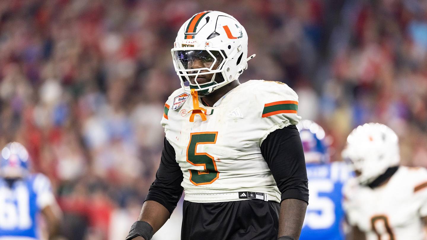 Jan 8, 2026; Glendale, AZ, USA; Miami Hurricanes defensive lineman Justin Scott (5) against the Mississippi Rebels during the 2026 Fiesta Bowl and semifinal game of the College Football Playoff at State Farm Stadium. Mandatory Credit: Mark J. Rebilas-Imagn Images