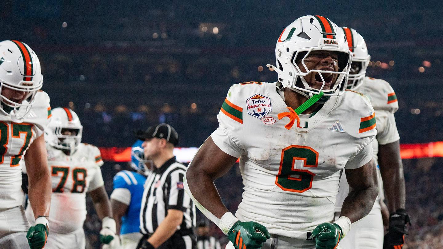 Miami Hurricanes running back CharMar Brown (6) celebrates his touchdown during the CFP Fiesta Bowl against Ole Miss at the State Farm Stadium, in Glendale, Ariz., on Thursday, Jan. 8, 2026.
