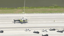 A Miami-Dade Fire Rescue helicopter lands on the Florida's Turnpike while responding to a crash involving an FHP vehicle on June 15, 2026.