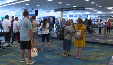 Passengers picking up their suitcases in the bag terminal at St.Pete-Clearwater Airport. (Spectrum News)