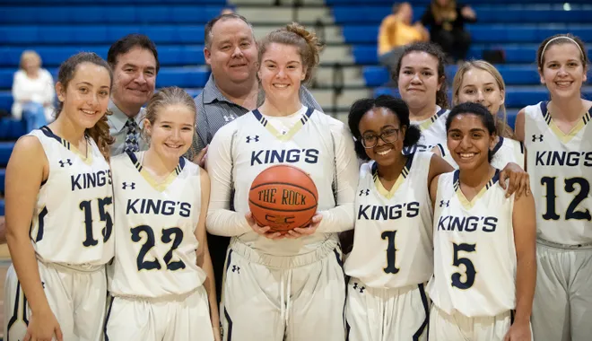 Southwest Florida Christian Academy's Rebekah Bergquist, center, celebrates with teammates after scoring her 2,501 point against Marco Island on Thursday at SFCA in Fort Myers.