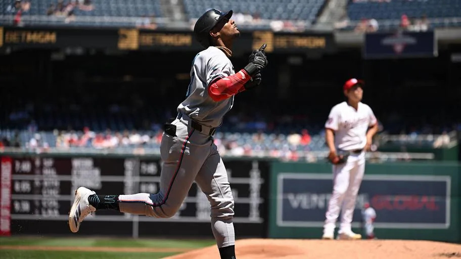 Miami Marlins right fielder Esteury Ruiz looks to the sky after hitting a home run.