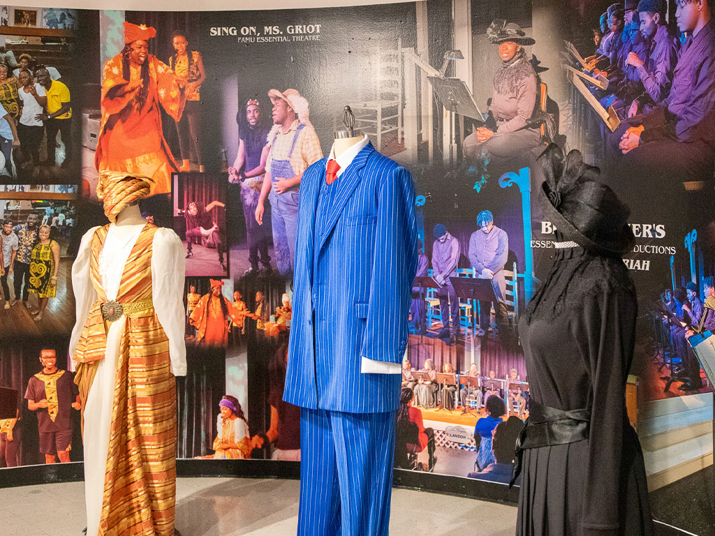 Costumes from FAMU Essential Theatre productions are displayed alongside archival imagery in the “Black Masks” exhibition at Florida A&M University’s Foster-Tanner Fine Arts Gallery. (Photo courtesy of FAMU Essential Theatre.)