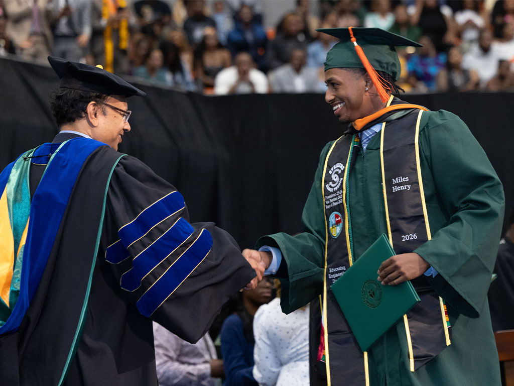 Dean Suvranu De, Ph.D., dean of the FAMU-FSU College of Engineering, congratulates a graduating engineering student during Florida A&M University's Spring 2026 Commencement Ceremony. This year's graduating cohort marked the largest group of FAMU engineering graduates in more than 25 years.