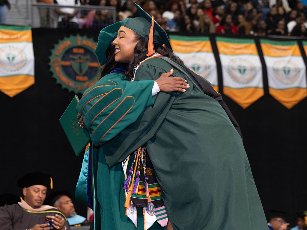 A Spring 2026 engineering graduate celebrates with Florida A&M University President Marva Johnson, J.D., during Commencement. The historic graduating class included 49 graduates who earned 50 engineering degrees, marking the largest FAMU engineering cohort in more than 25 years. (Photo courtesy Christian Whitaker)