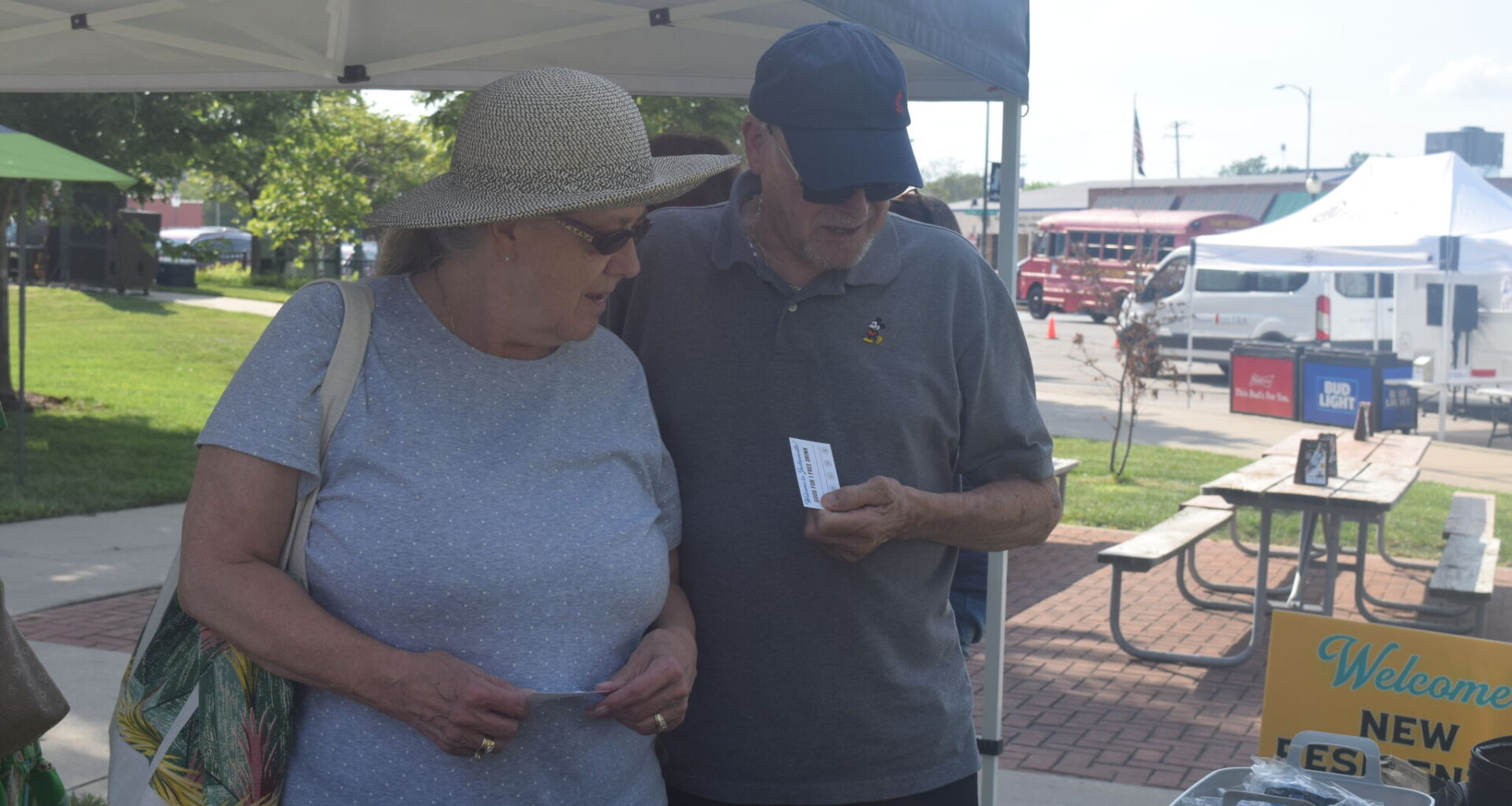 New residents Helma Borg (left) and Bert Borg look at promotional items during the 2025 New Resident Welcome Party. This year's welcome party will be June 12, during Jacksonville Main Street's Downtown Concert Series.