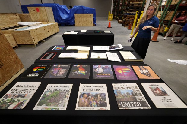 Orlalndo Sentinel editions and other publications are among artifacts and items collected after the Pulse tragedy. Those items are pictured at a climate-controlled warehouse in Orlando on Tuesday, June 2, 2026. Pulse artifacts that have been carefully removed from the site, packaged for preservation and stored in custom crates, may soon be used for later display as part of the Pulse Memorial. (Stephen M. Dowell/Orlando Sentinel)