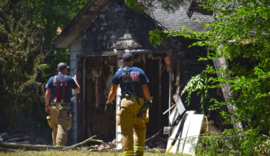 Jacksonville firefighters check for any rekindling of a fire at 731 N. Main St. A fire started inside the garage about 6:30 a.m. Wednesday and firefighters returned two more times because of smoke.