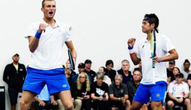 Tanapatt Nirundorn tossing the tennis ball in the air for his serve in doubles against UCF in NCAA Second Round.