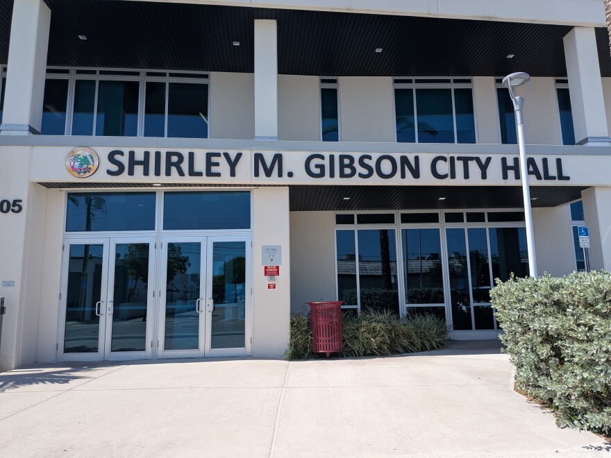 The front of a building with the words: "Shirley M. Gibson City Hall" above the door.