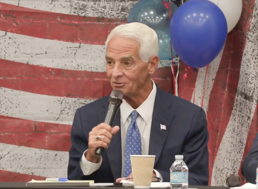Man speaking at a microphone