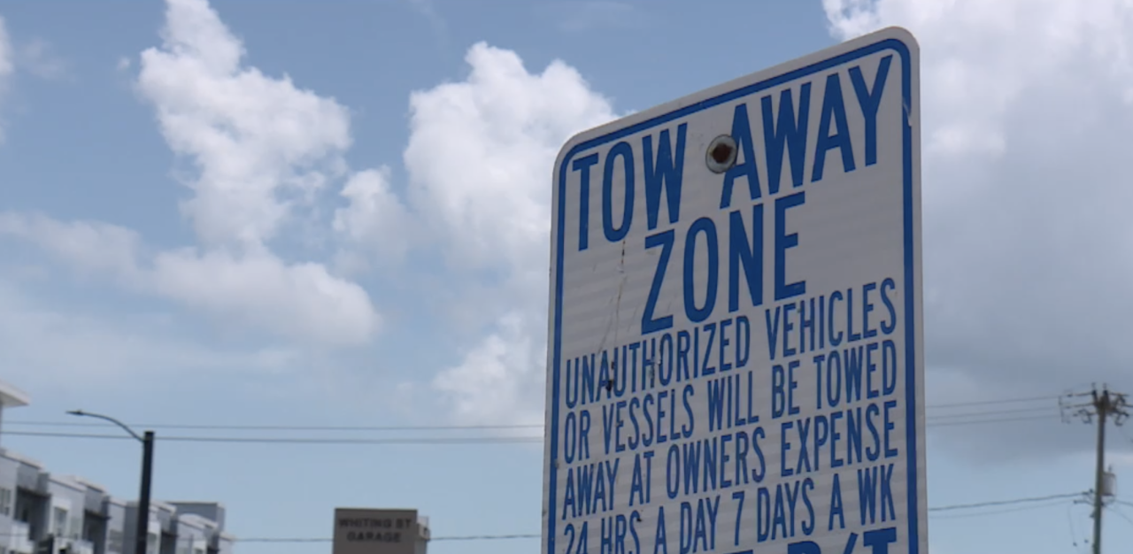 A grandfather is speaking out, claiming his granddaughter paid to park at a downtown Tampa lot and still had her car towed.