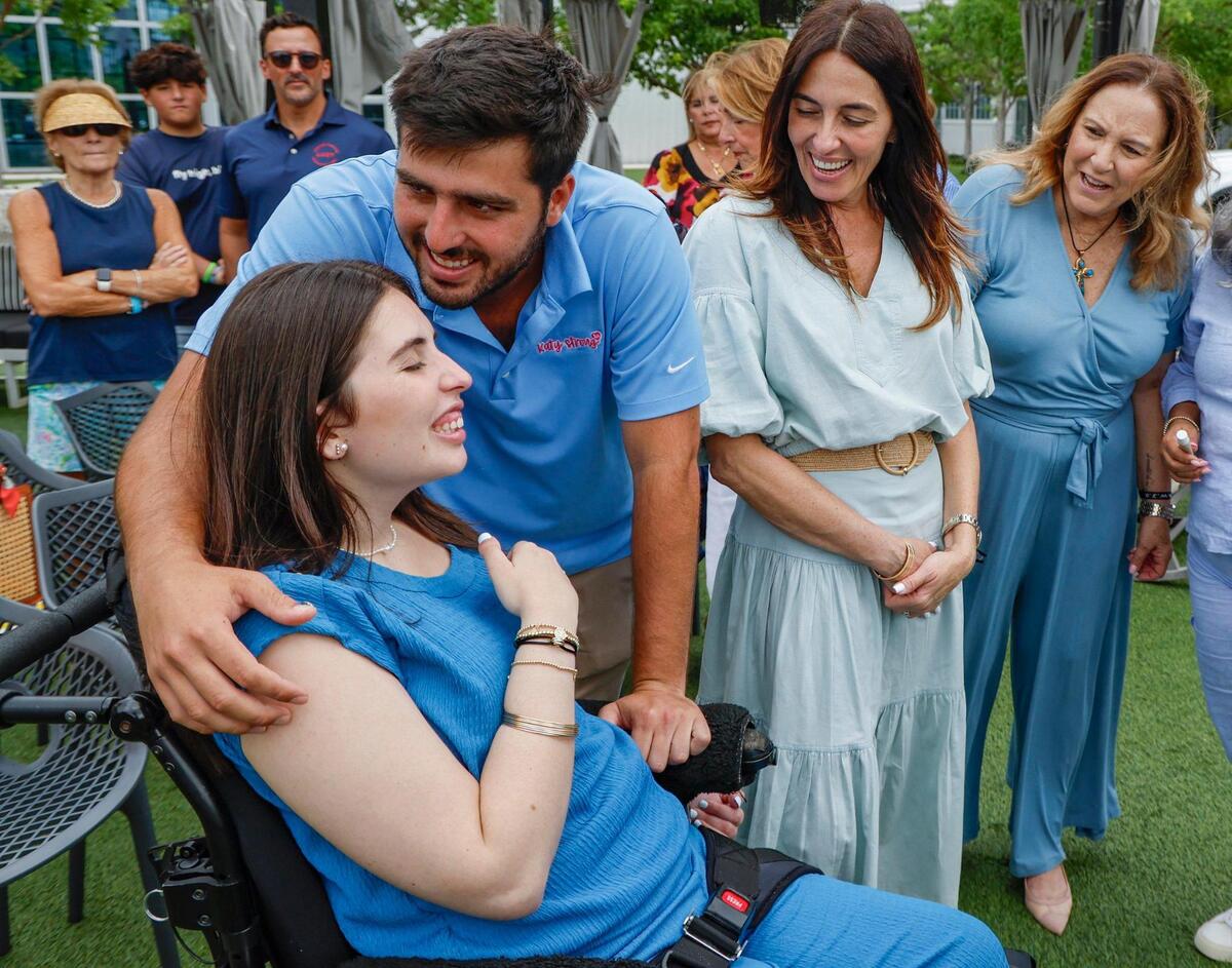 Katerina ‘Katy’ Puig receives a hug from her brother, Rudy Puig Jr., on July 2, 2025. Puig suffered severe injuries due to the crash.