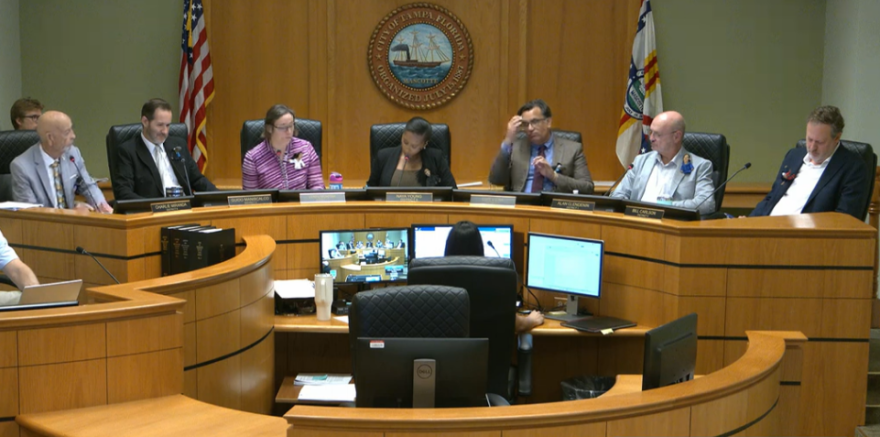 People sitting around a dais