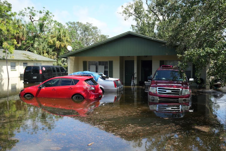 home and cars under water at a home in Tampa
