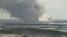 Crews were responding to a large brush fire in western Miami-Dade on Monday, officials said.