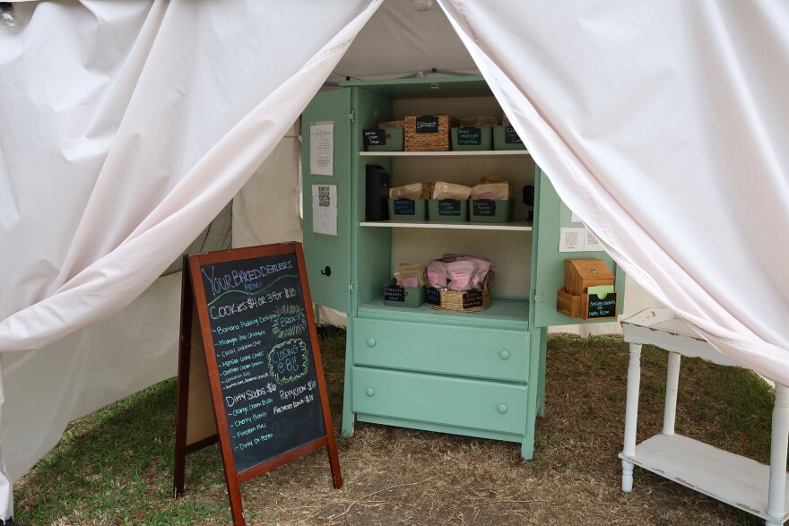 Your Baked Dealers farm stand sits under a tent to protect it from the heat in Ocala, Fla., on Tuesday, June 9, 2026. (Kaley Mantz/WUFT News)