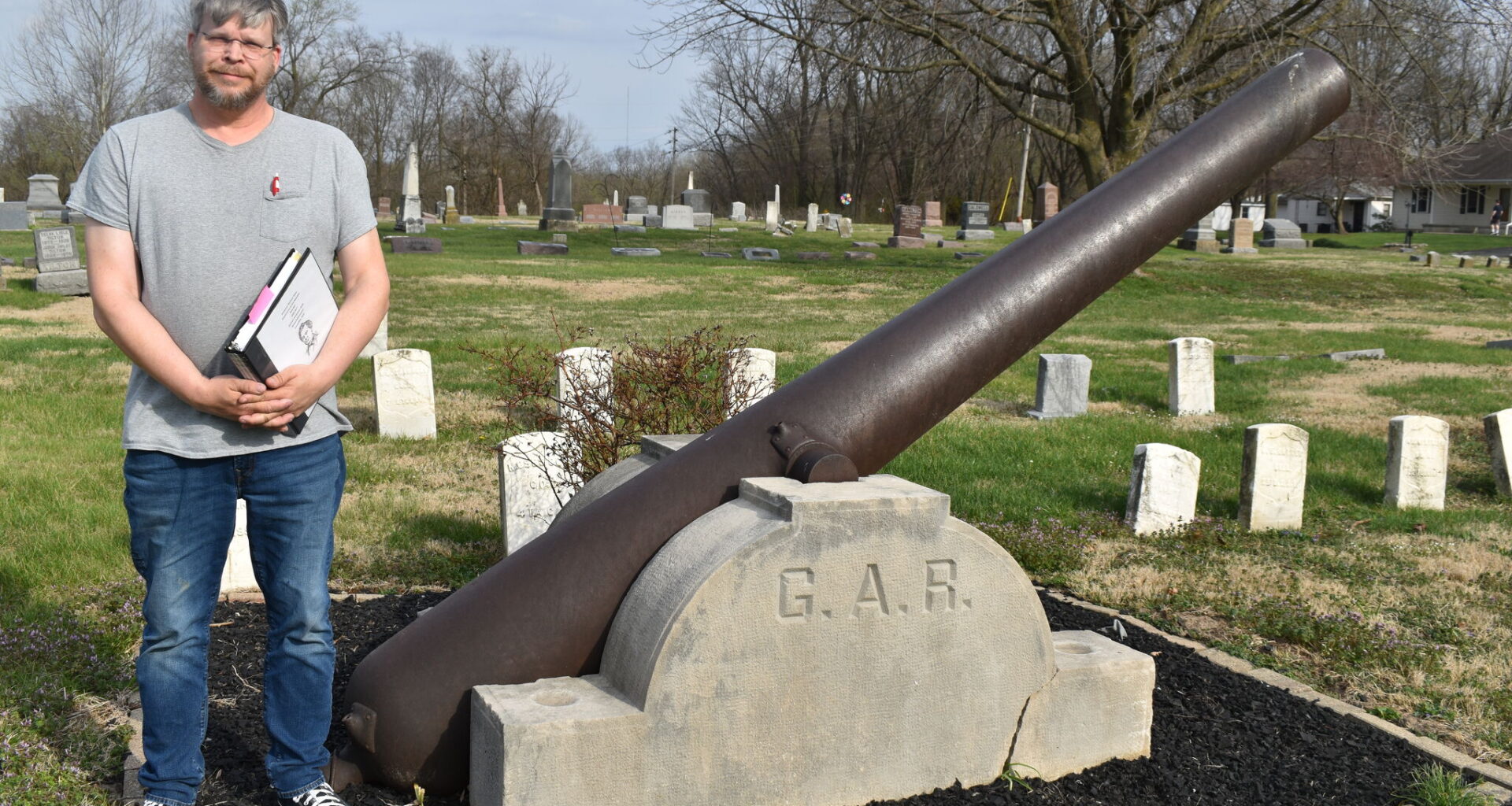 Historian Chad Boehlke stands near the Grand Army of the Republic memorial in East Cemetery. Six new headstones have been placed in East Cemetery honoring Black Civil War soldiers buried there.