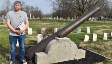 Historian Chad Boehlke stands near the Grand Army of the Republic memorial in East Cemetery. Six new headstones have been placed in East Cemetery honoring Black Civil War soldiers buried there.