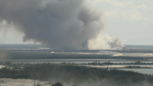 Crews were responding to a large brush fire in western Miami-Dade on Monday, officials said.