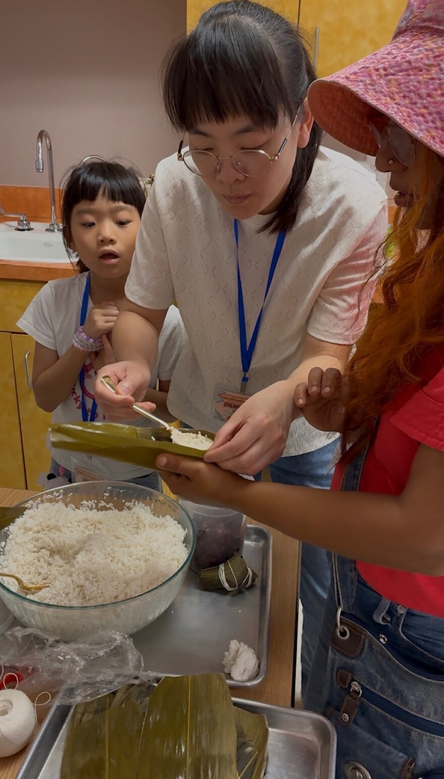 Participants prepare zongzi, traditional sticky rice dumplings wrapped in bamboo leaves, during Duanwu Festival celebrations on June 13, 2026, at the Chinese Alliance Church of Southwest Florida.