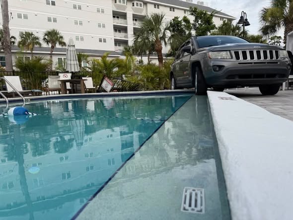 Jeep Teeters on the Edge of a Backyard Pool in Florida, and It's Not the First Time a Vehicle Has Found One