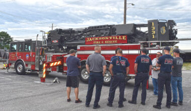 Jacksonville firefighters acquaint themselves with the capabilities of the department's newest fire truck. A public commissioning ceremony for the apparatus is set for Monday.