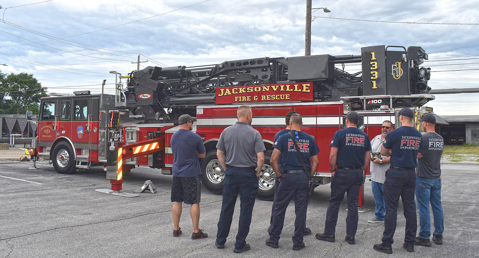 Jacksonville firefighters acquaint themselves with the capabilities of the department's newest fire truck. A public commissioning ceremony for the apparatus is set for Monday.