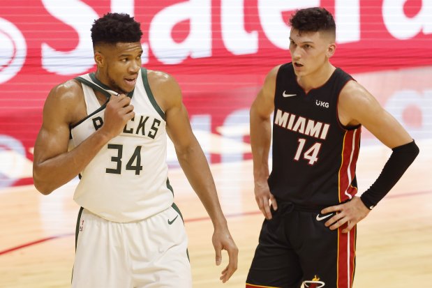 The Milwaukee Bucks' Giannis Antetokounmpo (34) and the Miami Heat's Tyler Herro (14) during the second quarter at American Airlines Arena in Miami on Tuesday, Dec. 29, 2020. Antetokounmpo poured in 54 points to help topple the Los Angeles Clippers Thursday, Feb. 2, 2023, in Milwaukee. (Michael Reaves/Getty Images/TNS)