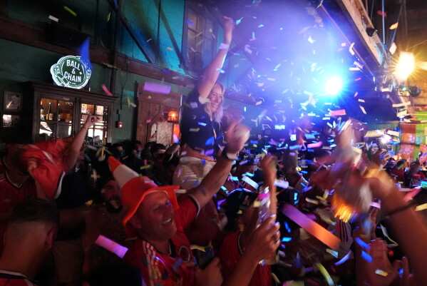 Scotland soccer fans with the Tartan Army chant and dance in the Ball and Chain music bar in Miami before marching to a Miami Marlins against the Texas Rangers baseball game Monday, June 22, 2026. (AP Photo/Rebecca Blackwell)