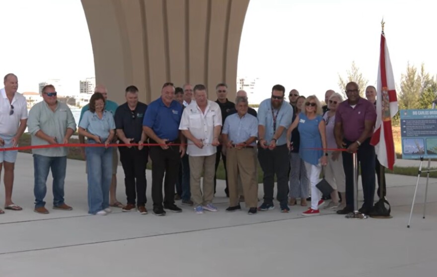 Lee County officials and others cut a ribbon to formally dedicate and conclude the Big Carlos Pass Bridge project Tuesday morning.
