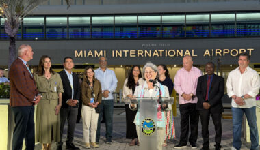 Miami-Dade County Mayor Daniella Levine Cava (center) with members of the Forward Flight team at the unveiling of MIA&rsquo;s lighting and beautification efforts for the FIFA 2026 World Cup.