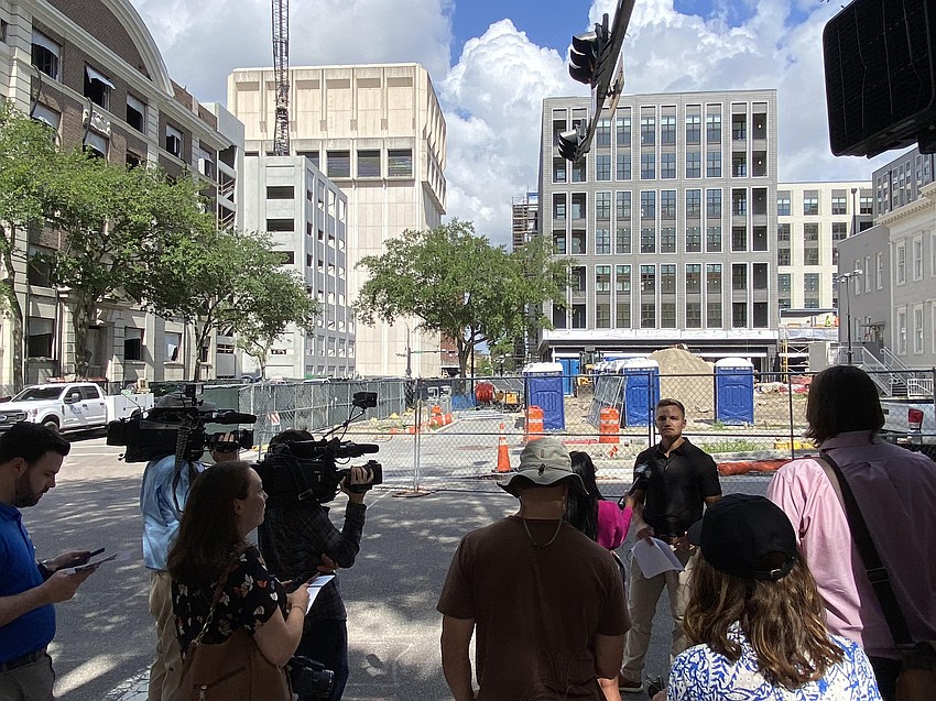 During a May 19 media tour of the Pearl Square district in Downtown Jacksonville, Gateway Jax CEO Bryan Moll fielded questions about the projects behind him in this photo: The Vandeveer apartments and retail building, at right, and Hotel Merrydelle, at left. A parking garage is under construction adjacent to the hotel, previously the Ambassador Hotel. During a May 19 media tour of the Pearl Square district in Downtown Jacksonville, Gateway Jax CEO Bryan Moll fielded questions about the projects behind him in this photo: The Vandeveer apartments and retail building, at right, and Hotel Merrydelle, at left. A parking garage is under construction adjacent to the hotel, previously the Ambassador Hotel.