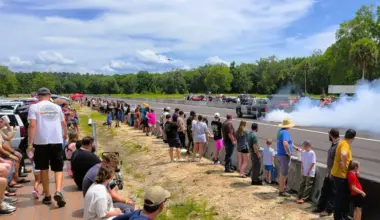 Cars do burnouts on the track of Hicken Power Dragstrip