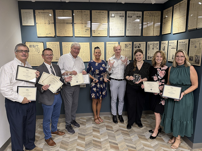 Angela Campbell, right, publisher of the Jacksonville Daily Record, joins staff members displaying awards won by the publication at the 2026 Florida Media Conference. From left are Stephen Reynolds, multimedia advertising consultant; Ric Anderson, editor; Dan Macdonald, staff writer; Codi Rinehart, graphic designer; Joe Lister, staff writer; Kaili Cochran, news designer; and Karen Brune Mathis, editor at large; and Campbell. Angela Campbell, right, publisher of the Jacksonville Daily Record, joins staff members displaying awards won by the publication at the 2026 Florida Media Conference. From left are Stephen Reynolds, multimedia advertising consultant; Ric Anderson, editor; Dan Macdonald, staff writer; Codi Rinehart, graphic designer; Joe Lister, staff writer; Kaili Cochran, news designer; and Karen Brune Mathis, editor at large; and Campbell.