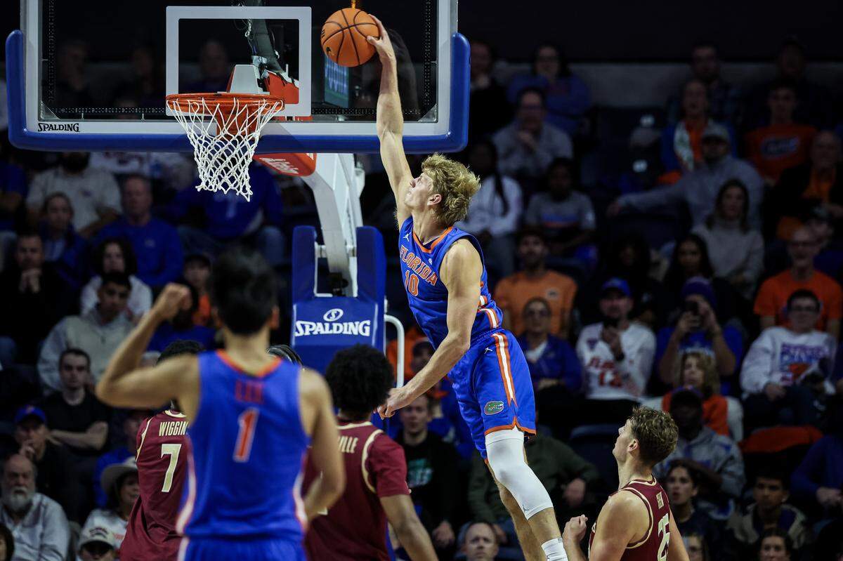GAINESVILLE, FLORIDA - NOVEMBER 11: Thomas Haugh #10 of the Florida Gators dunks in the second half against the Florida State Seminoles at the Stephen C. O'Connell Center on November 11, 2025 in Gainesville, Florida. (Photo by James Gilbert/Getty Images)